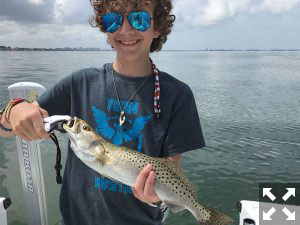 Nick Hoeksema with a nice trout he landed in the bay.