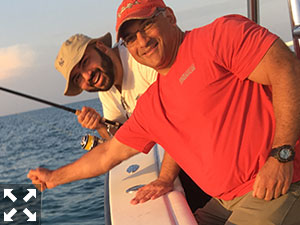 Nick DeMarco and his dad Ernie with a tarpon Nick caught and released.