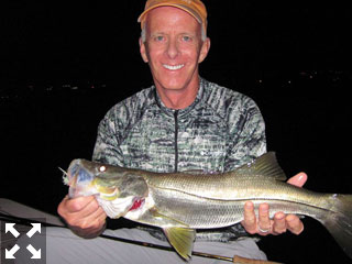 Stewart Lavelle, from Siesta Key, with a snook caught and released on a fly with Capt. Rick Grassett.