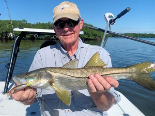 Keith McClintock, from Lake Forest, IL, with a snook caught and released on a CAL jig with a shad tail while fishing Tampa Bay with Capt. Rick Grassett.