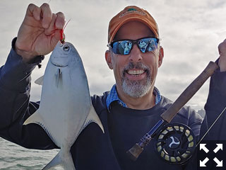 Pete Taurus with a nice pompano he hooked while Flyfishing with Capt. Kelly Stilwell.