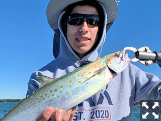 Tyler Horiuchi, from Sarasota, with a Spanish mackerel caught and released on a fly while fishing with Capt. Rick Grassett.