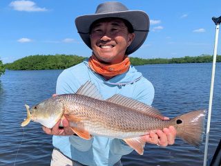 Jon Yenari, from Sarasota, with a red he caught and released on a CAL Shad while fishing Gasparilla Sound with Capt. Rick Grassett recently.