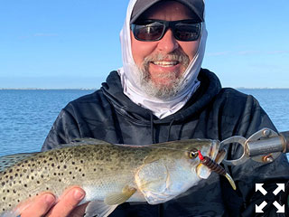 Cliff Ondercin, from Sarasota, with a trout he caught and released on a CAL jig with a grub while fishing Sarasota Bay with Capt. Rick Grassett.