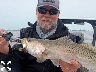 Capt. Rick Grassett with a Gasparilla Sound trout caught and released on a CAL jig with a grub recently.