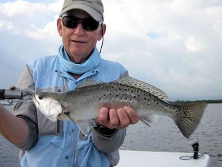 March should be a good month to fish deep grass flats. Ray Hutchinson, from MI, caught and released this trout on a Clouser fly while fishing Sarasota Bay with Capt. Rick Grassett in a previous March.
