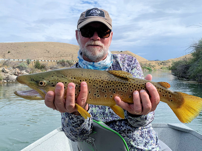 Capt. Rick Grassett with a nice brown trout caught and released on a fly while fishing with King Outfitters out of Dillon, MT.