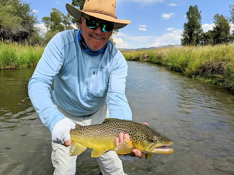 Dennis Kinley, from IN, with a nice brown trout caught and released on a fly while fishing with King Outfitters out of Dillon, MT recently.