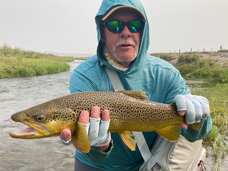 Mike Perez, from Sarasota, with a nice brown trout caught and released on a fly while fishing with King Outfitters out of Dillon, MT recently.