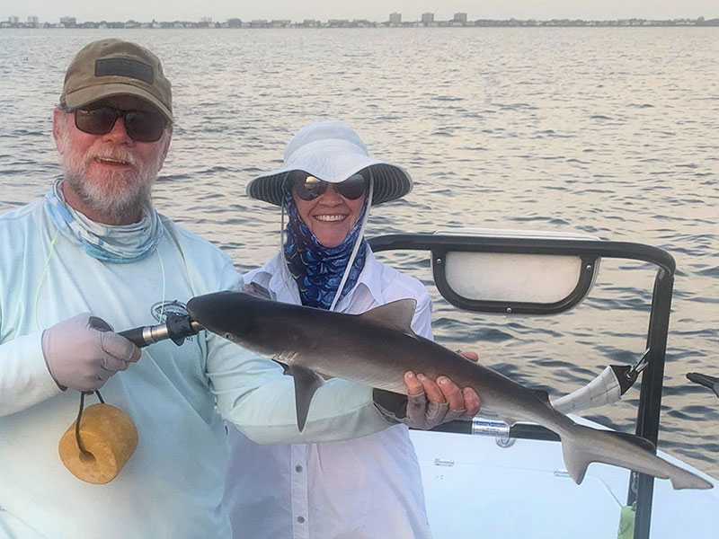 Pat Beckwith, from Sarasota, with a shark caught and released on a Clouser fly while fishing Sarasota Bay with Capt. Rick Grassett recently.