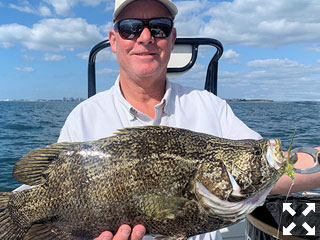 Kirk Grassett. from Middletown, DE, with a tripletail he caught and released on flies while fishing with Capt. Rick Grassett recently.
