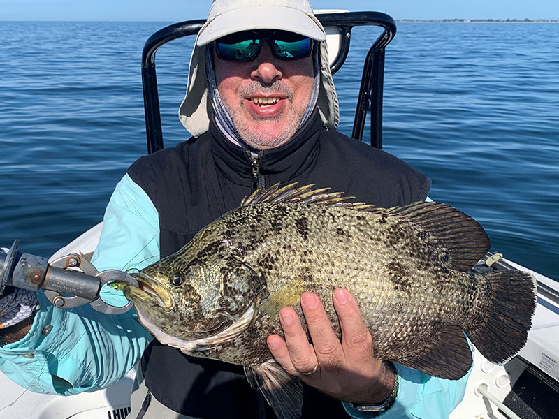 Patrice Camillieri, from France, with a tripletail caught and released on a fly while fishing with Capt. Rick Grassett recently.