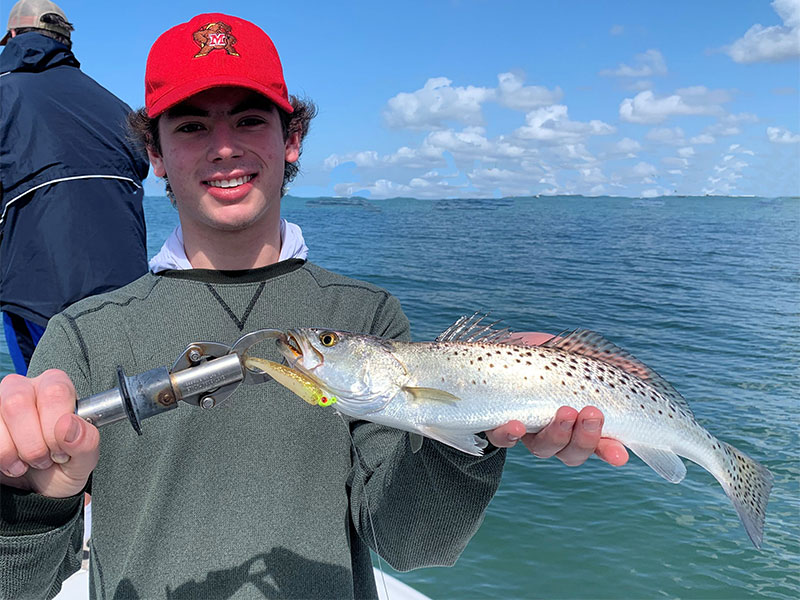 Chris Morrison, from MA, with a Sarasota Bay trout caught on a CAL jig with a shad tail while fishing with Capt. Rick Grassett recently.