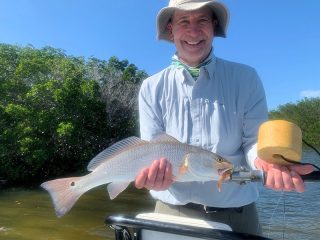 Dave Smid, from Springfield, MO, with a red caught and released on CAL jigs with shad tails fishing Gasparilla Sound with Capt. Rick Grassett recently.
