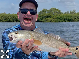 John, from Pennsylvania, with a nice looking Redfish he caught and released while fishing Sarasota Bay.