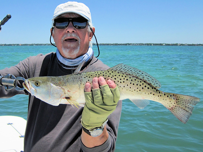 There should be good action on deep grass flats during May. Bill Morrison, from Anna Maria, caught this fat trout on a Clouser fly while fishing Sarasota Bay with Capt. Rick Grassett in a previous May.
