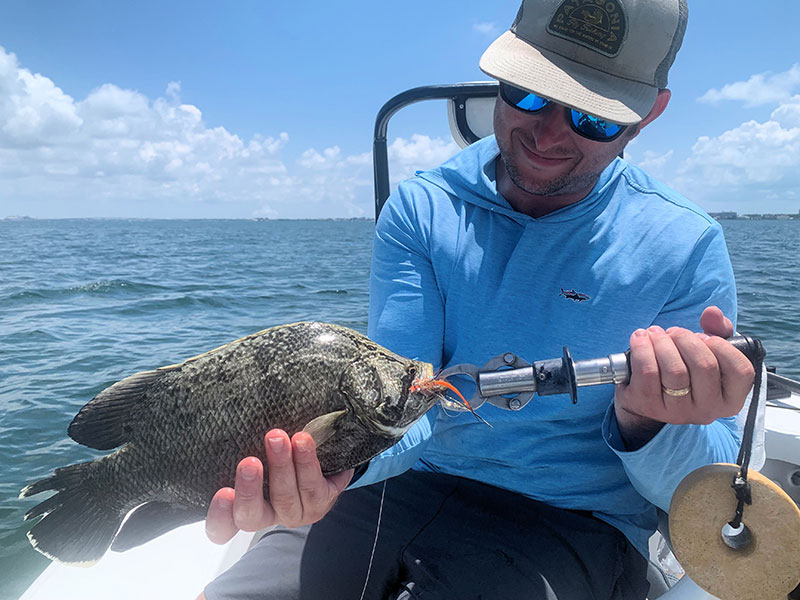 Jeff Lasoski, from WI, with a Tripletail caught and released on a fly while fishing with Capt. Rick Grassett. 