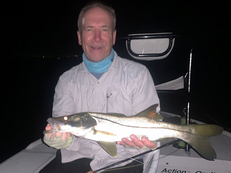 Dave Smid, from Springfield, MO, had good action catching and releasing snook on flies while fishing before dawn in Sarasota Bay with Capt. Rick Grassett recently. 