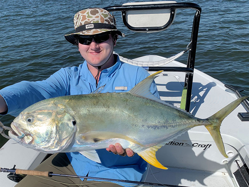 Andrew Terry, from Longboat Key, with a 14-lb jack crevalle caught and released on a fly while fishing Sarasota Bay with Capt. Rick Grassett recently.