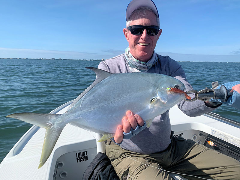 Marshall Dinerman, from Lido, with a big pompano caught and released on a CAL jig with a shad tail while fishing Sarasota Bay with Capt. Rick Grassett in a previous November.