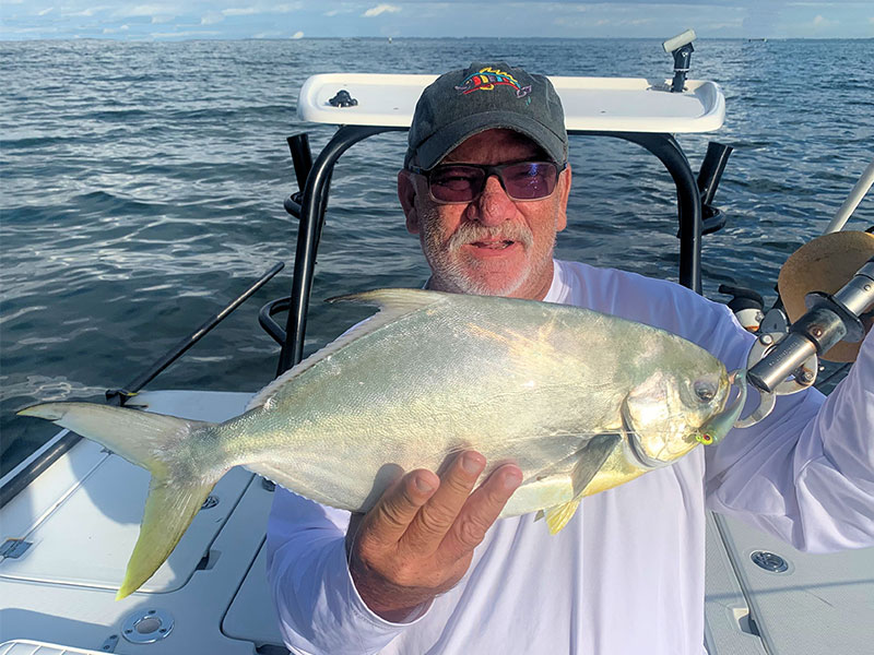 Joey Grassett, from Seaford, DE, with a pompano on a CAL jig with a shad tail.