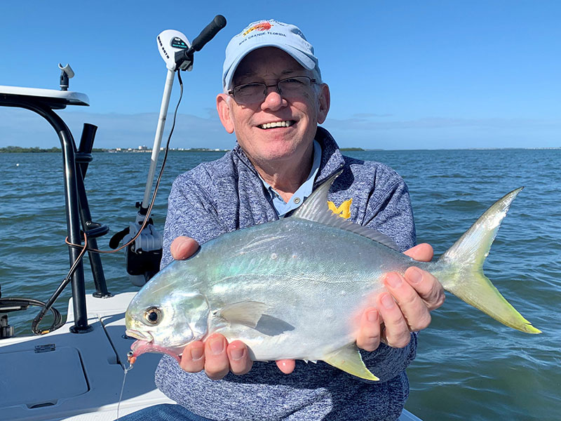 There should be good fly fishing action on deep grass flats of Sarasota Bay during December. Ray Hutchinson, from MI, with a pompano he caught and released on flies while fishing with Capt. Rick Grassett on a couple of trips in a previous December.