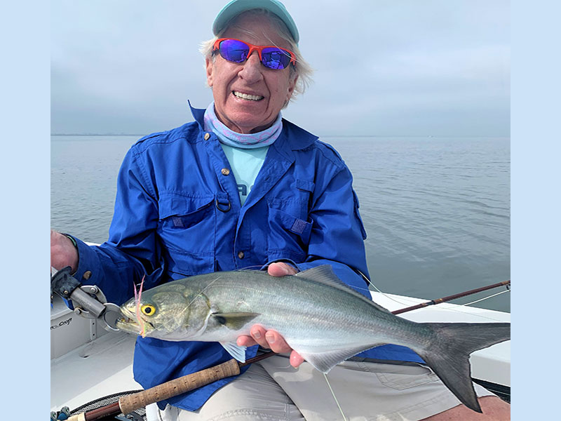 Stephen Smith, from NJ, with a Bluefish he caught and released on Clouser flies while fishing with Capt. Rick Grassett.