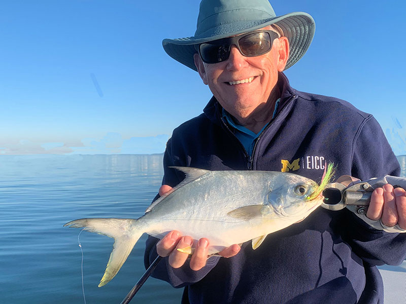 Ray Hutchinson, from MI, with a Pompano, both caught and released on Clouser flies while fishing with Capt. Rick Grassett recently.