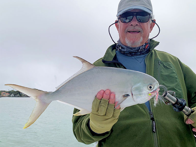 Bill Morrison, from Anna Maria, with a pompano caught and released on a fly while fishing with Capt. Rick Grassett in a previous February. 