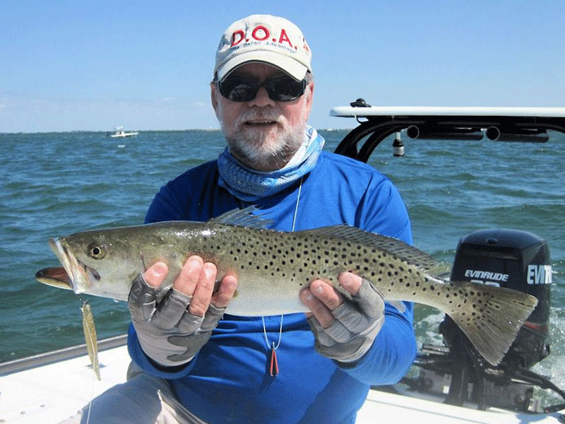 Capt. Rick Grassett with a trout caught and released on CAL jigs with a shad tail in a previous April.