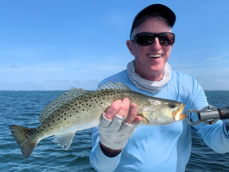 Marshall Dinerman, from Lido, with a Trout caught and released on CAL jigs with shad tails while fishing the deep grass flats of Sarasota Bay with Capt. Rick Grassett recently.