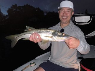 Isaac Lee, from GA, with a snook caught on a fly.
