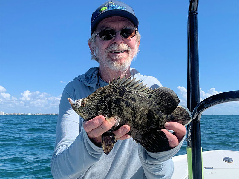 Rusty Chinnis displaying a tripletail.