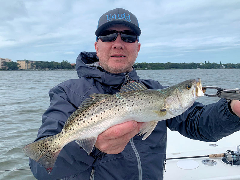 Brian Nafzinger, from MD, with a trout he caught and released on CAL jigs with shad tails while fishing with Capt. Rick Grassett in a previous November.
