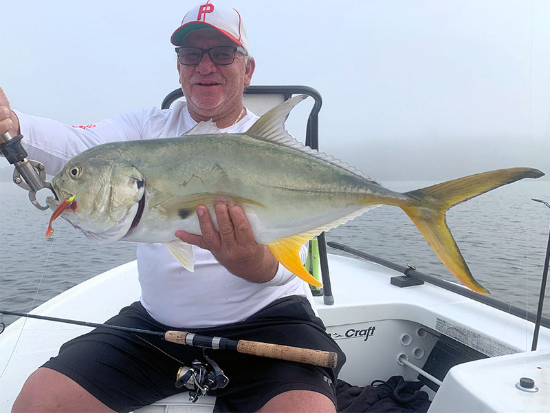 Joe Grassett, from Seaford, DE, with a big jack caught and released on DOA Lures while fishing with Capt. Rick Grassett in a previous December.