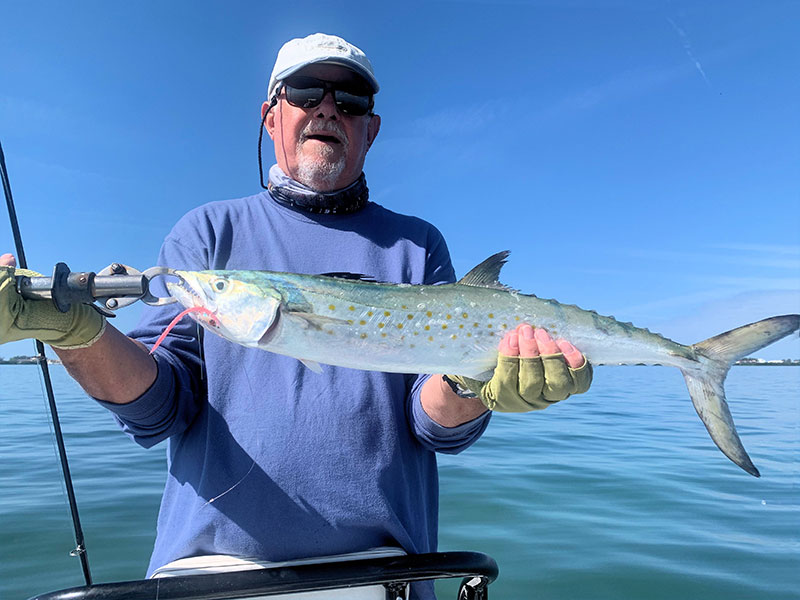Bill Morrison, from Anna Maria, with a Spanish mackerel caught and released in a previous March while fishing with Capt. Rick Grassett.