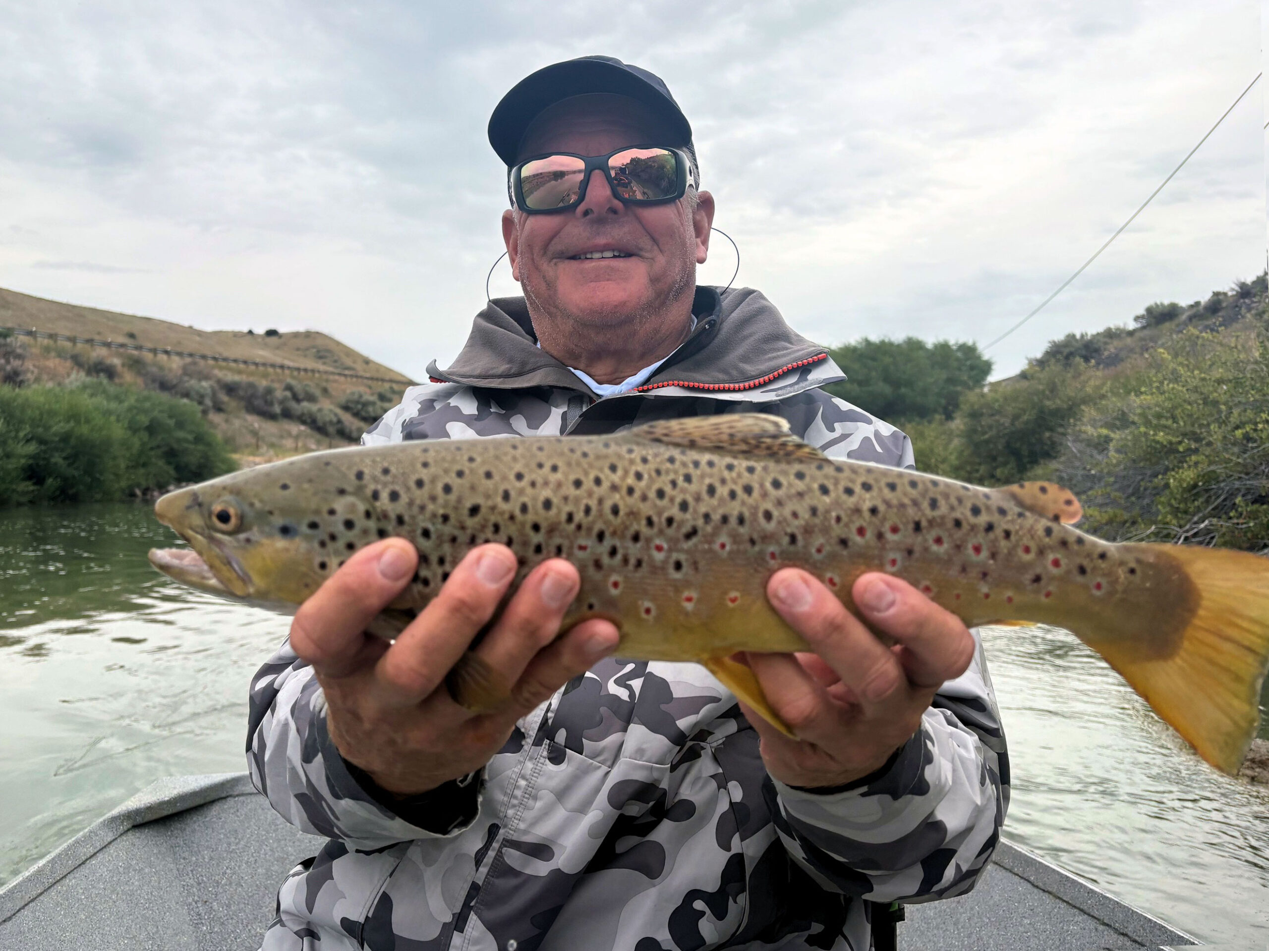 Jim Kuhlman, from Nokomis, FL, with a nice Montana brown trout caught and released on a fly.