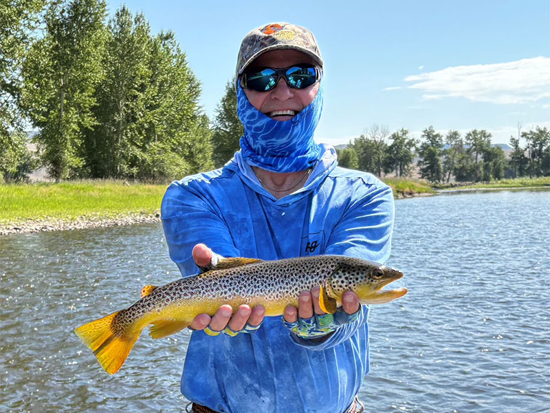 Trevor Elmquist, from Pine Island, FL, with a healthy fly caught Montana brown trout.